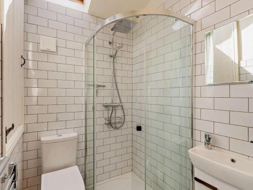 a bathroom with a shower with a toilet and a sink at 2 Bed in Lancaster oc-91411 in Clapham