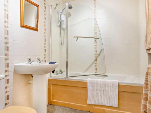 a bathroom with a shower and a sink and a tub at 2 Bed in Skipton oc-92898 in Airton