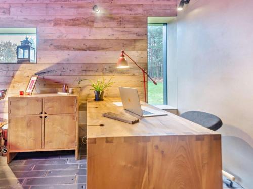 an office with a wooden desk with a laptop on it at 2 Bed in Lymington oc-95021 in Brockenhurst