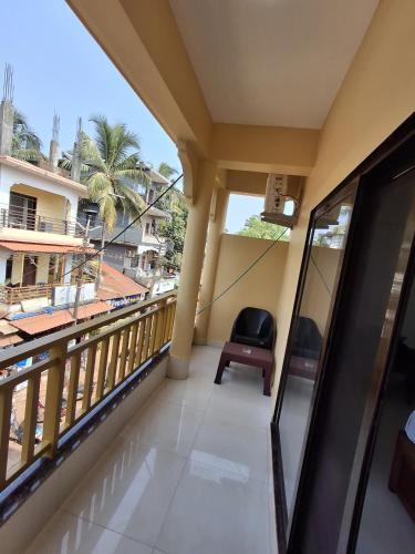 a balcony with a view of the city at Prakash Holiday Inn in Arambol