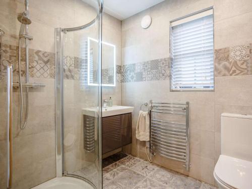 a bathroom with a shower and a sink at 2 Bed in Lairg oc-86104 in Durness