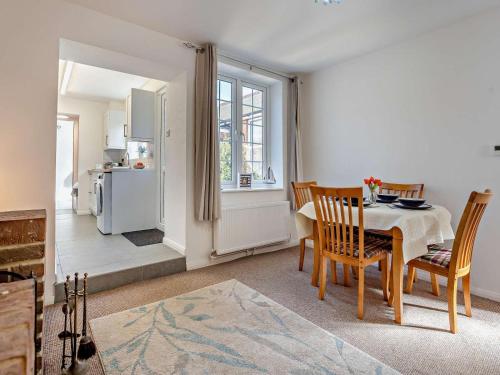 a kitchen and dining room with a table and chairs at 2 Bed in Freshwater oc-91606 in Freshwater