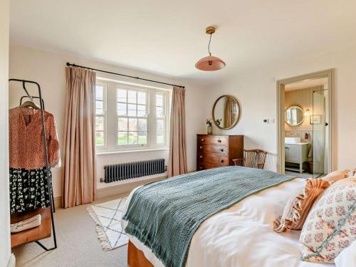a bedroom with a bed and a dresser and a window at 2 Bed in Helmsley oc-92946 in Helmsley