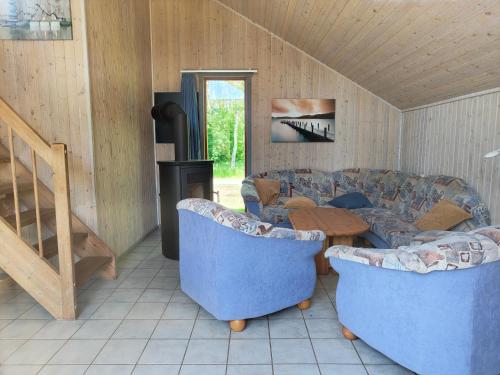 a living room with a couch and a table at Wildgans 87 in Mirow
