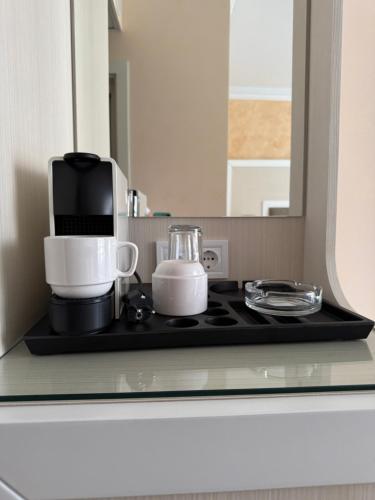 a coffee maker on a counter in a kitchen at Sun Boutique Pomorie in Pomorie
