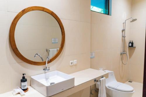 a bathroom with a sink and a mirror at Hikari Hill View Villa 7 Bedrooms With a Private Swimming Pool and a Billiard Table in Bandung