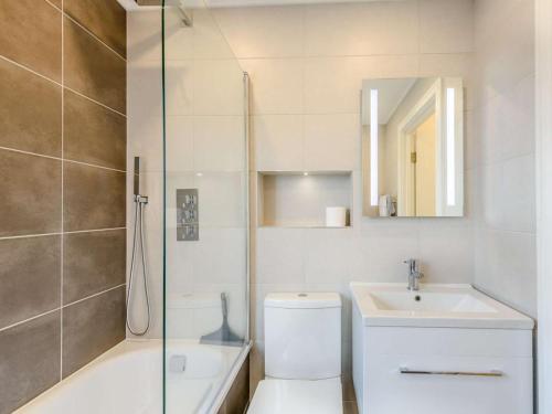 a bathroom with a toilet and a sink and a shower at 2 Bed in Lyndhurst oc-82132 in Lyndhurst