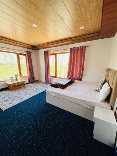 a bedroom with a large bed in a house at Rongmo villa in Leh