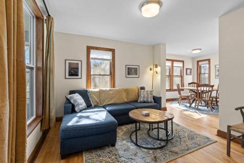 a living room with a couch and a table at The Longfellow Bungalow in Minneapolis