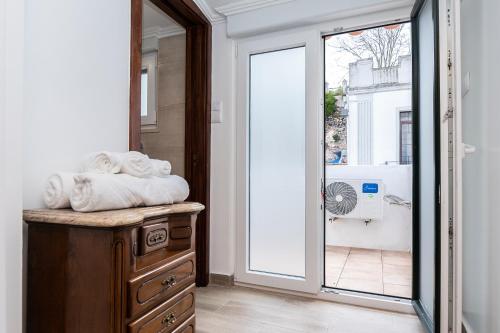 a room with a door leading to a patio at Casa da Muralha in Beja