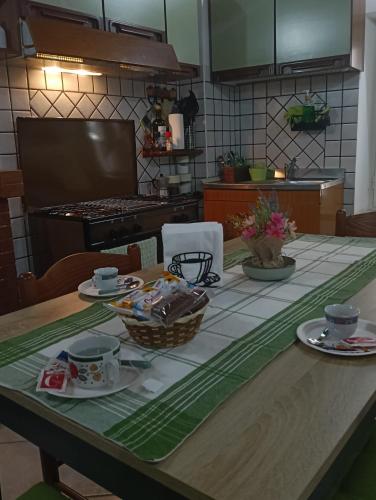 a kitchen with a table with food on it at Lo chalet del vicolo in Roccasecca dei Volsci