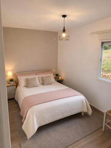 a bedroom with a large bed and a window at Maset Paradiso in Vanacloig