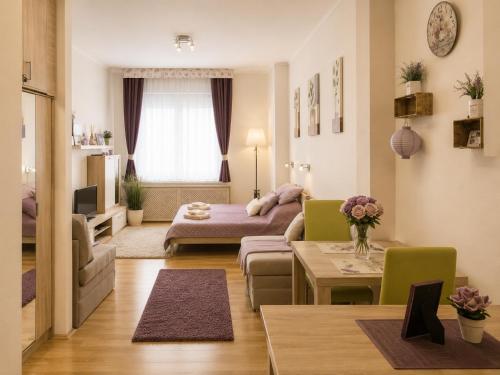 a living room with a couch and a table at Andy's Home Central Apatment in Budapest