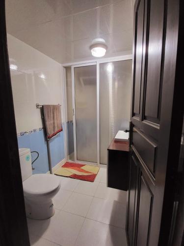 a bathroom with a toilet and a shower at عين السلطان ain sultan in Imouzzer du Kandar