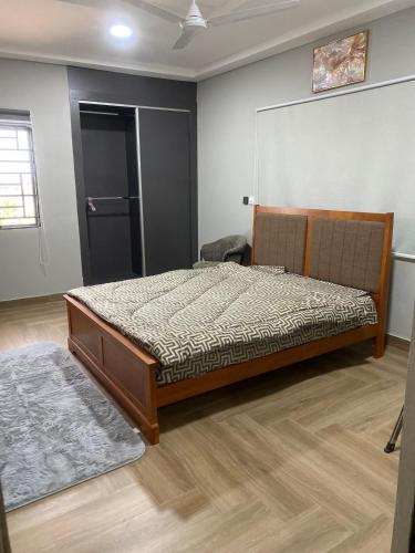 a bedroom with a bed in a room at The Dunamis in Accra