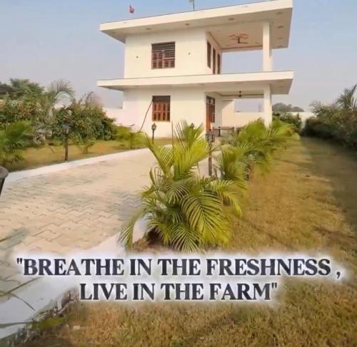 a house with the words breathe in the freshness live in the farm at Mandys Farm House in Manjhāoli