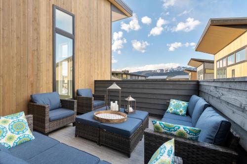 a patio with couches and a table and chairs at Quarry B8 in Whitefish