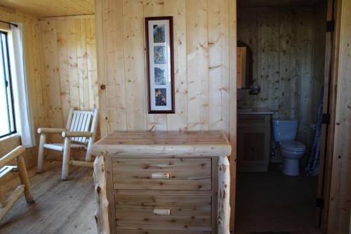 a log cabin with a sink and a toilet at Drakesbad Guest Ranch in Chester