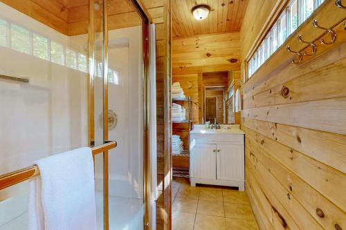 a bathroom with a shower and a sink at Leavitt Bay Shores in Ossipee