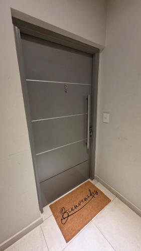 a door in a room with a mat in front of it at TORRE GUAYASAMIN in Corrientes