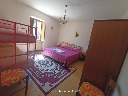 a room with two bunk beds and a table at Da Carlo in Pietralunga