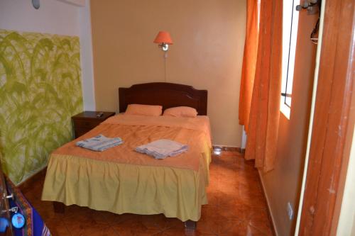 Postel nebo postele na pokoji v ubytování Aldos Guest House