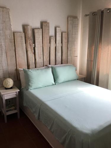 Postel nebo postele na pokoji v ubytování Ten North Tamarindo Beach Hotel
