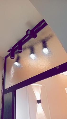 a room with a ceiling with a light on it at Karak Castle House in Kerak