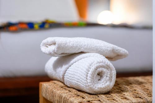 a pile of towels sitting on top of a table at Ahomé Guest house & Lounge in Lomé