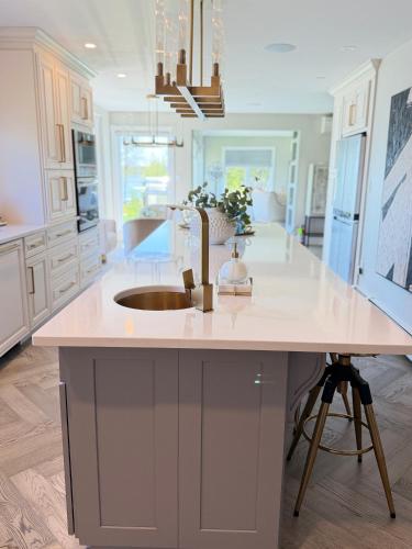 a kitchen with a sink and a counter top at luxury Beachfront Home With Private Beach Access in Charlottetown