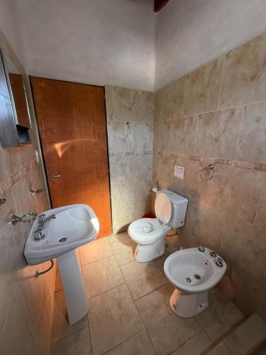 a bathroom with a sink and a toilet at Romedeptos II in Merlo