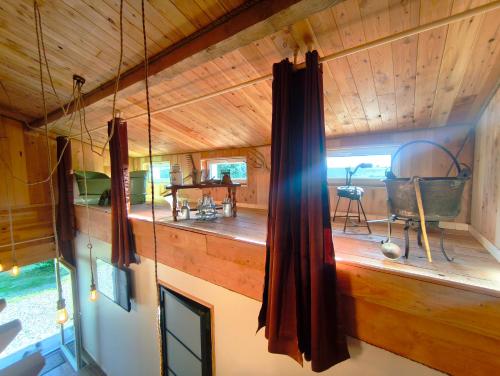 an inside view of a cabin with wooden walls and ceilings at Domaine de buffevent in Cintegabelle