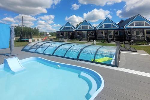 Two-story holiday homes, summer pool, sauna