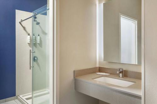 a bathroom with a sink and a shower at Fairfield Inn by Marriott Ponca City in Ponca City