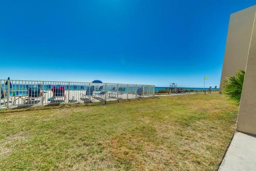 a playground with the ocean in the background at Beach House Condominiums C103 - Beachfront with Pool, Wi-Fi, & Beach Service in Destin