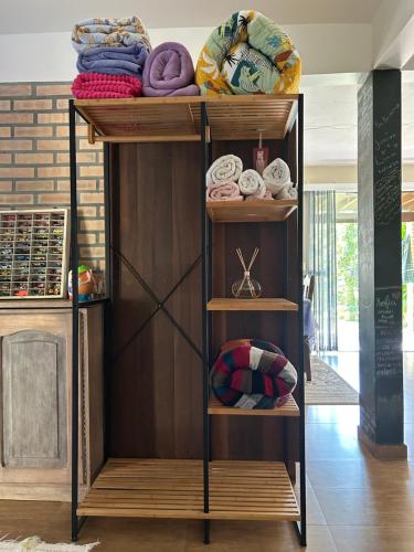 a wooden shelf with knick knacks on it at Espaço Aconchego in Pomerode