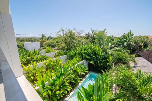 a view of the garden from the balcony of a villa at U Villas - Tropical Views Luxury Stay with Pool & Workspace in Ungasan