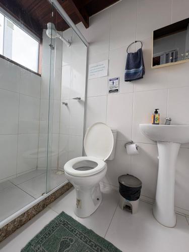 a bathroom with a toilet and a sink and a shower at Mi casa Su casa Lofts - LOFT 5 in Angra dos Reis