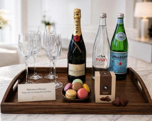 a wooden tray with wine glasses and wine bottles at Princess Palace Monaco in Monte Carlo