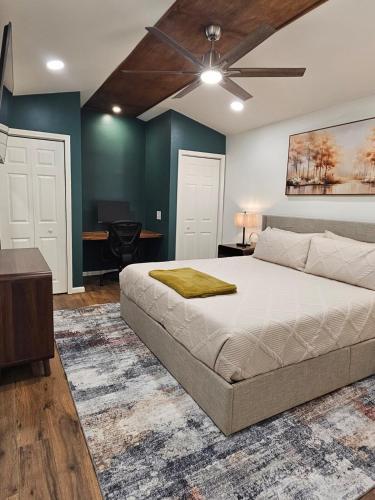 a bedroom with a bed and a ceiling fan at Tiny Home with Grill Laundry Deck Desk in Phenix City