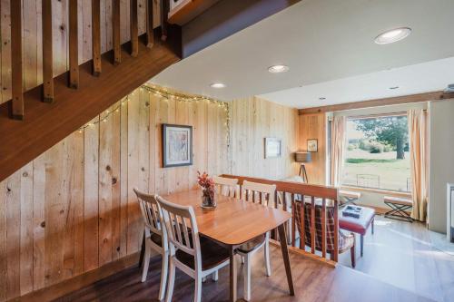 a dining room with a wooden table and chairs at Lakeview Meadow Retreat in Sisters