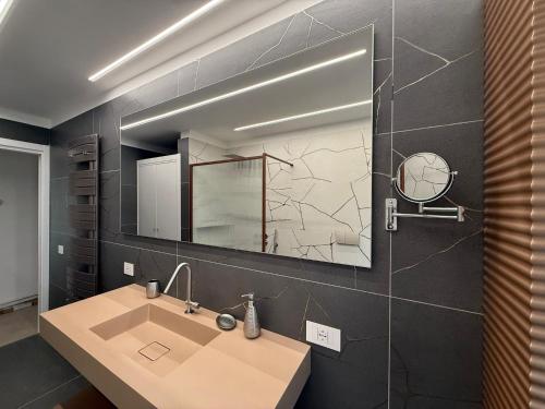 a bathroom with a sink and a mirror at Villa Heaven Sperlonga in Itri