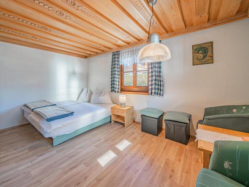 a bedroom with a bed and a table and chairs at Elisabeth II in Wald im Pinzgau