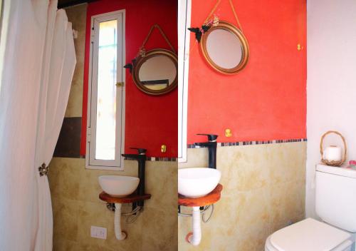 a bathroom with two mirrors and a toilet at LOFT Huayna picchu in La Falda