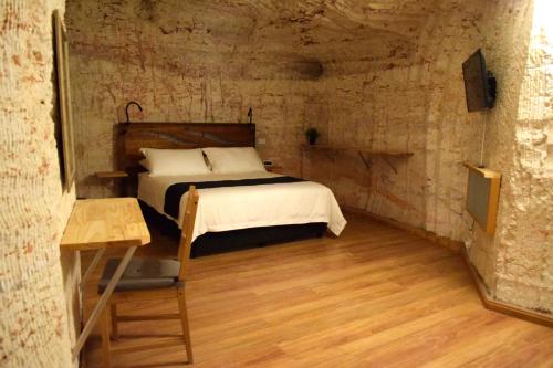 Postel nebo postele na pokoji v ubytování Dug Out B&B