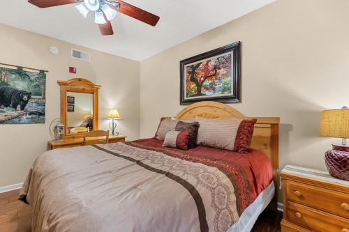 a bedroom with a bed and a ceiling fan at WP231 Old Mill Overlook in Pigeon Forge