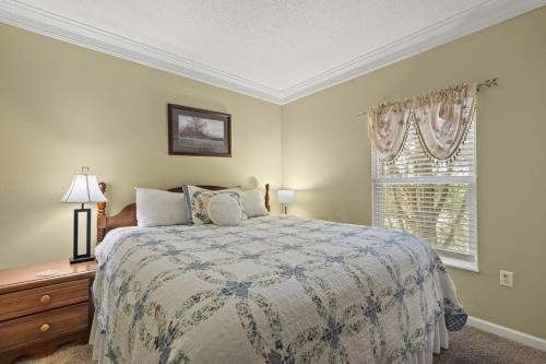 a bedroom with a bed and a window at WP431 Private Sunsets in Pigeon Forge