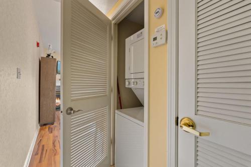 a door to a kitchen with a stove and an oven at WP431 Private Sunsets in Pigeon Forge