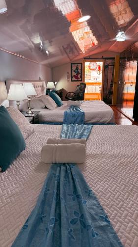 a hotel room with three beds in a room at Casa Salento in Salento