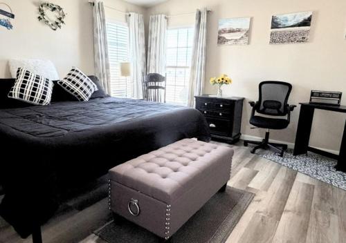 a bedroom with a bed and a chair and a desk at Pahrump Vacation House #1, DeathValley-Las Vegas, Readaways-Healthy Mind in Pahrump